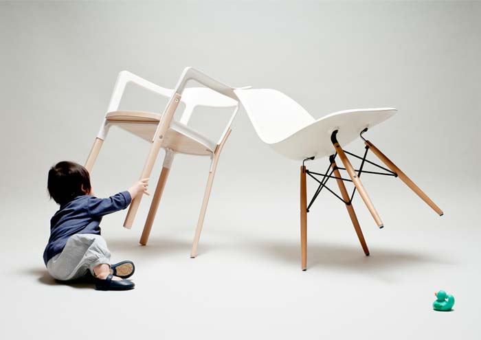 toddler playing with chairs