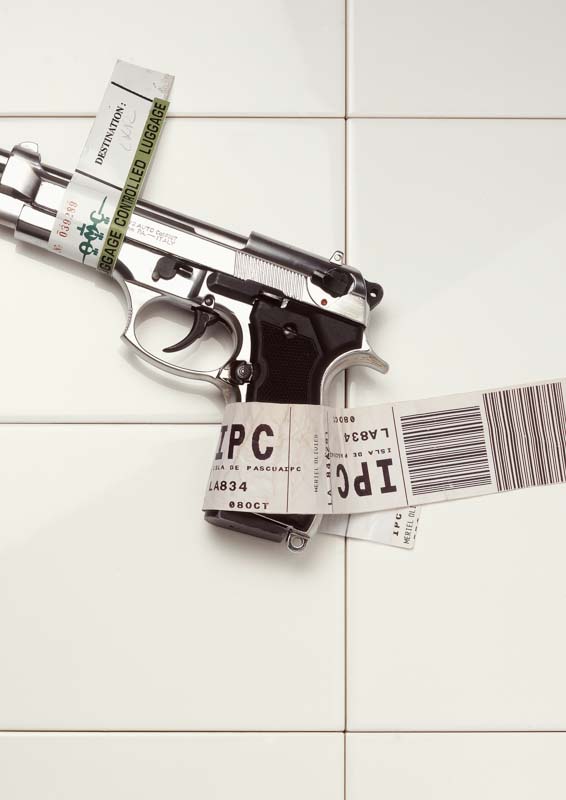 luggage security tag on a gun