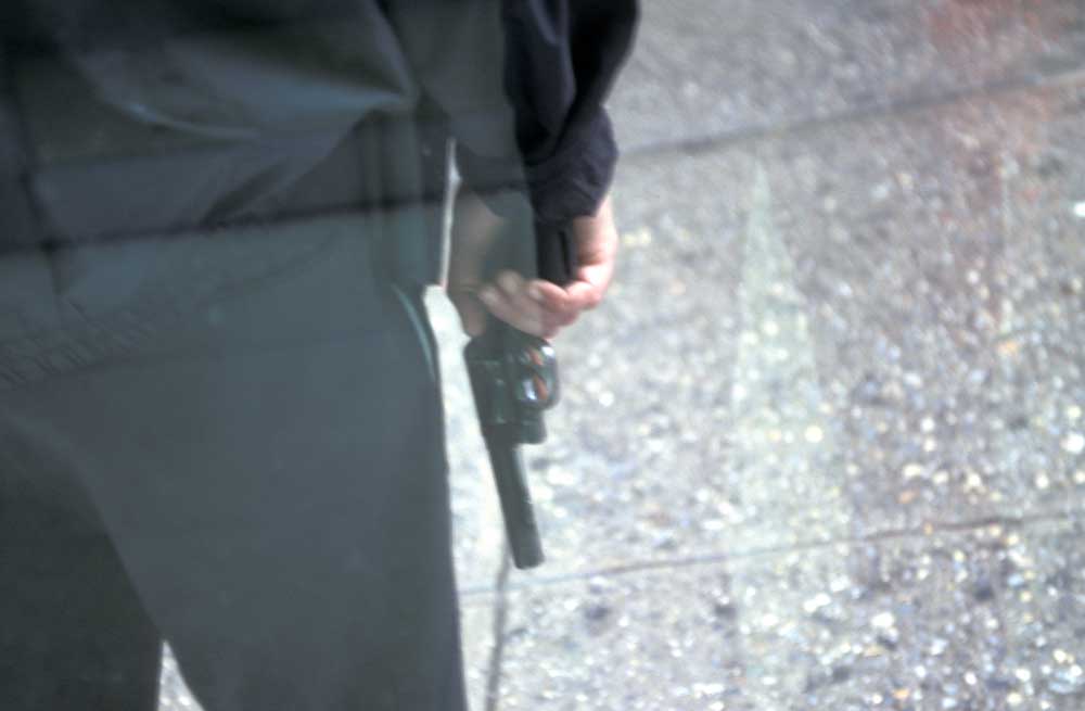 Officer holding revolver