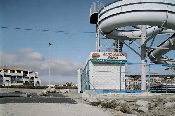 water chute and closed takeaway in a desolate surrounding