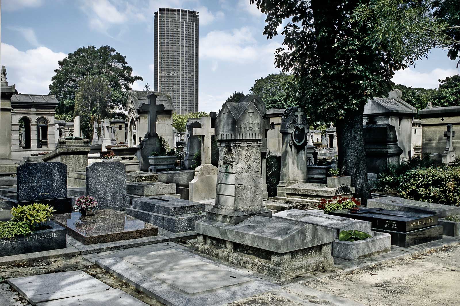 look over the Montparnasse cemetery Paris to the Montparnasse tower
